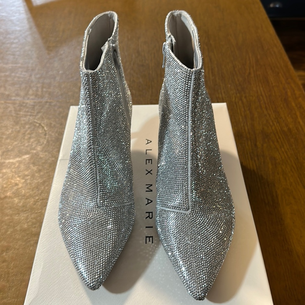 Size 10 Alex Marie Silver Bootie. Worn twice. 2 minor blemishes on each.boxed